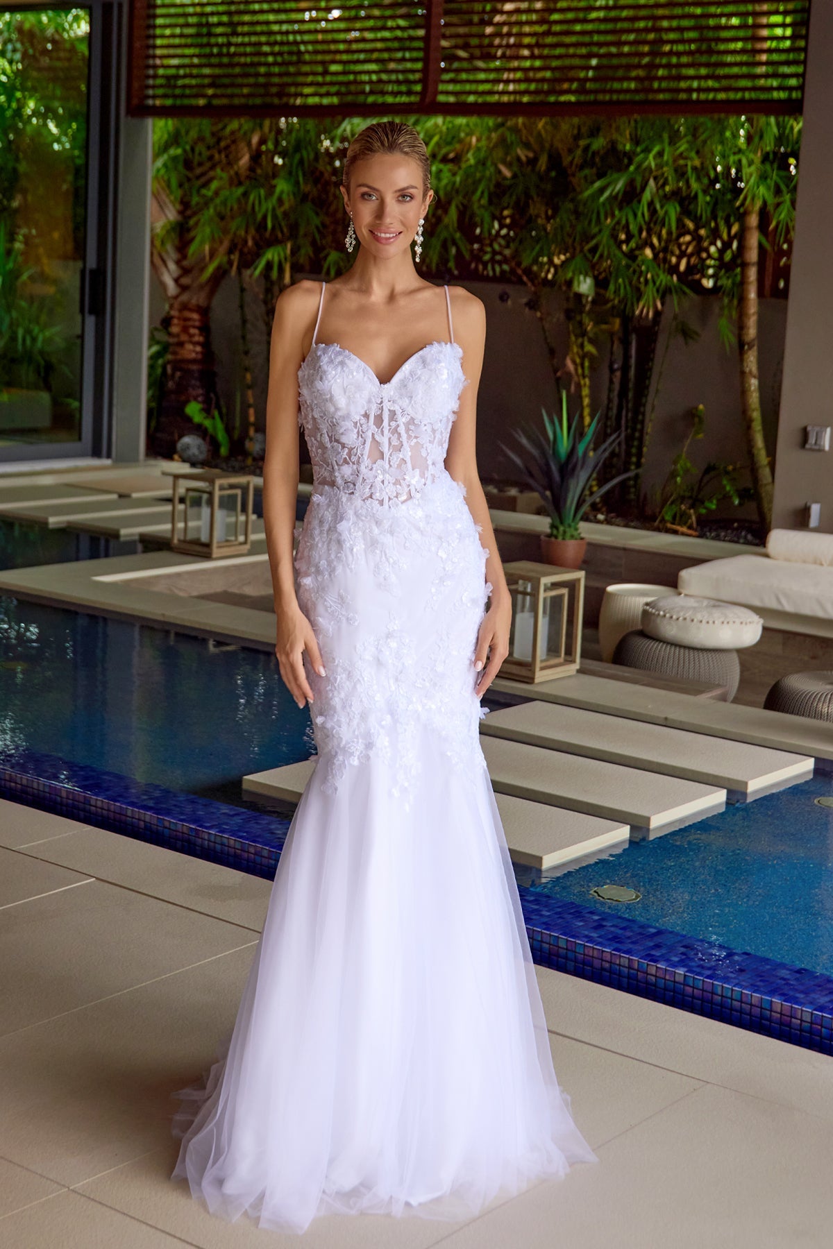 White sweetheart trumpet gown with textured lace bodice and flared tulle skirt