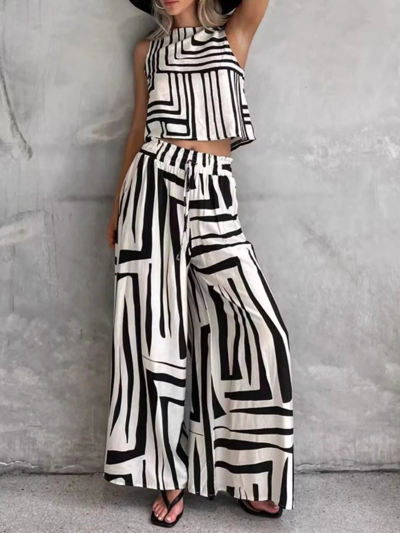 Sleeveless geometric print top and wide-leg pants set, striped black-and-white.