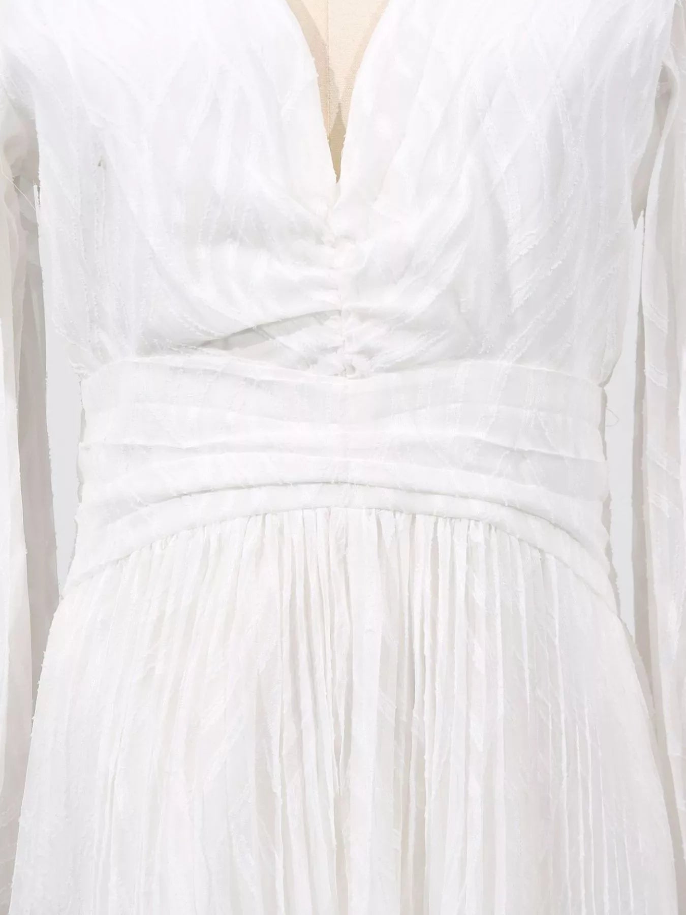 White ruched v-neck bodice with elastic waist gathers and sheer textured fabric