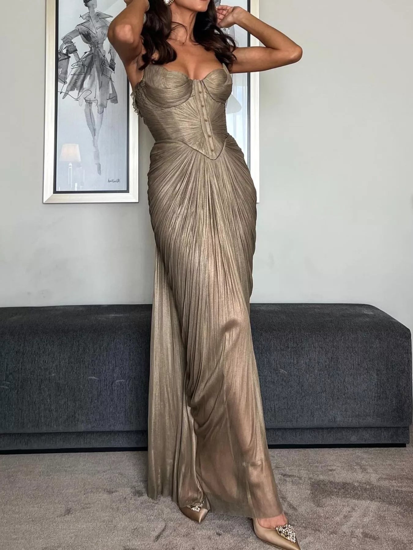 Gold metallic pleated corset maxi dress with sweetheart bodice and draped skirt