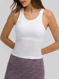 White round-neck racerback active tank with ribbed texture and fitted length