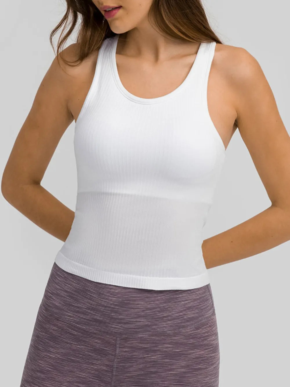 White round-neck racerback active tank with ribbed texture and fitted length