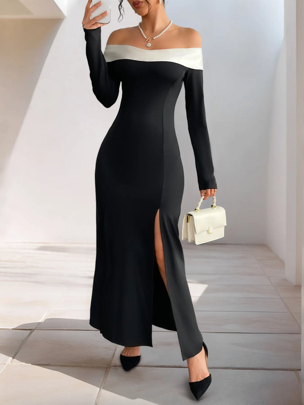 Black off-shoulder maxi dress with contrast neckline, side slit detail on skirt
