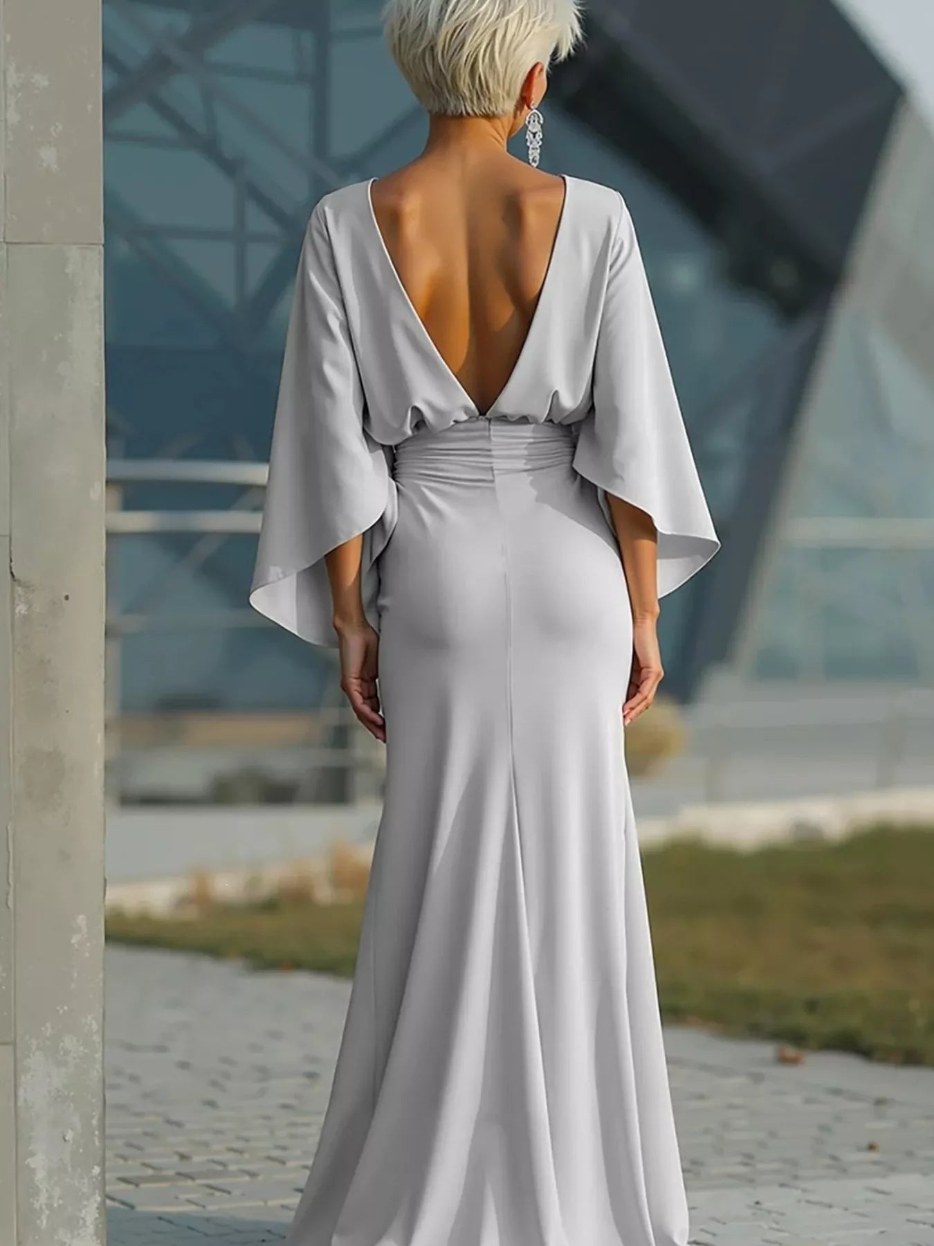 Silver satin maxi dress with batwing sleeves and open V-back, ruched waist