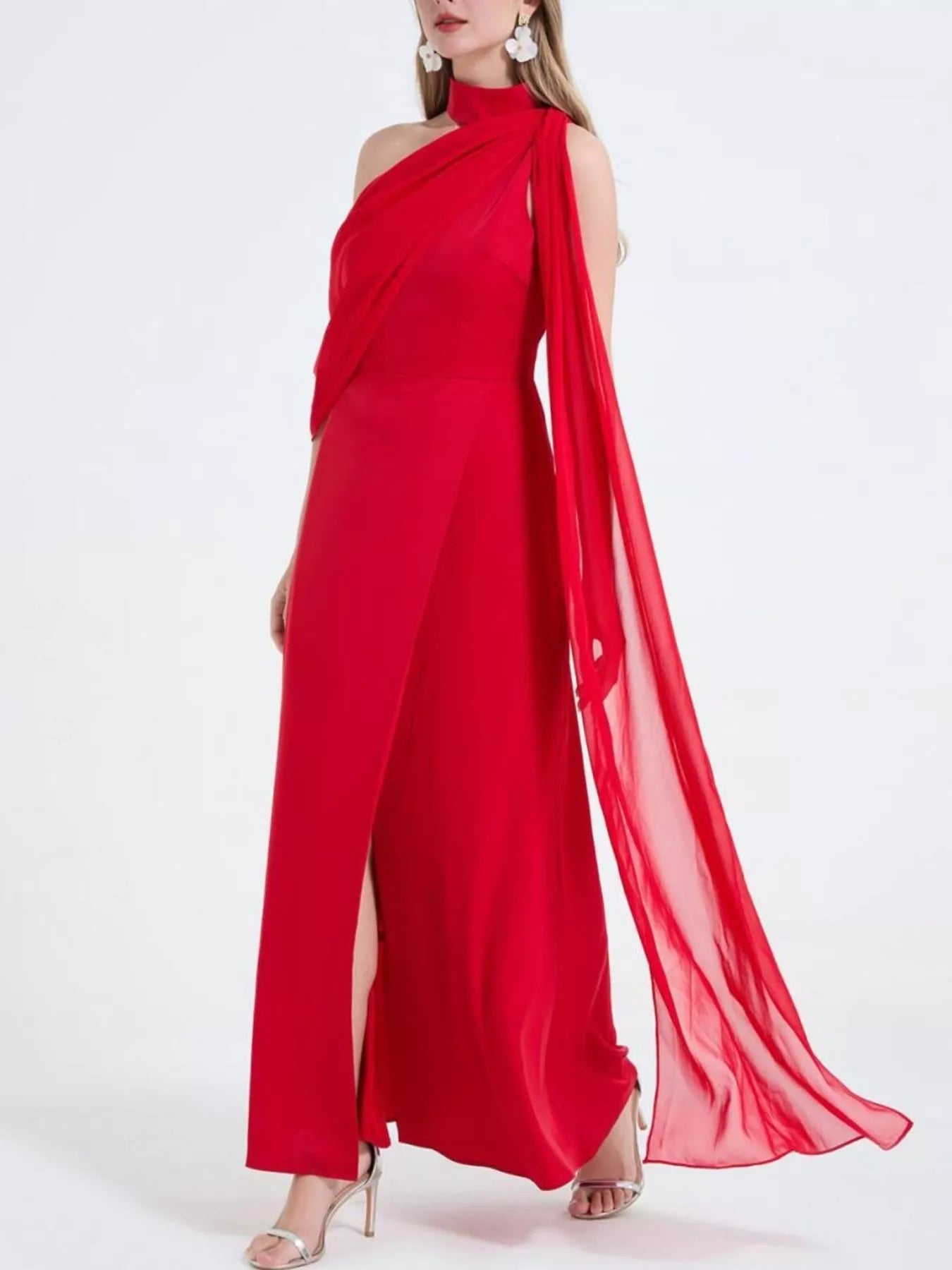Red halter-style maxi dress with high side slit and flowing sheer overlay panel