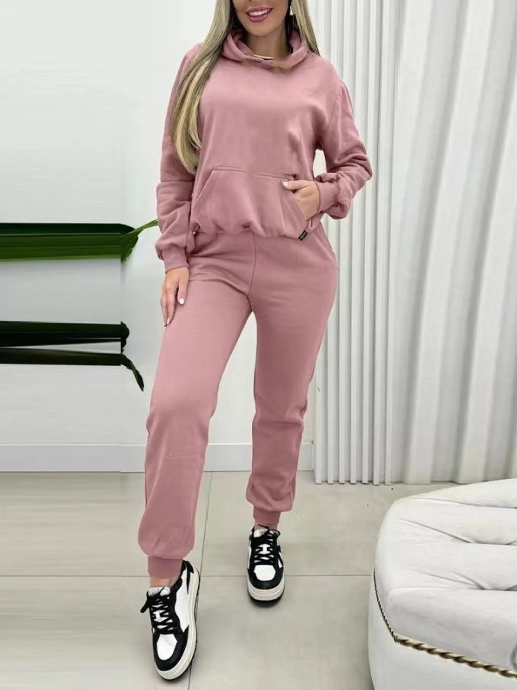 Pink long-sleeve hoodie and joggers set with hood, drawstring, and front pocket