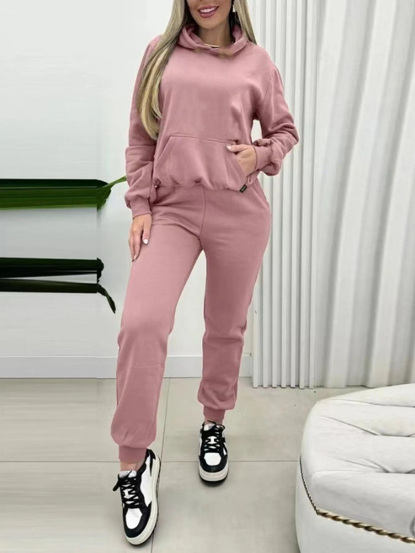 Pink long-sleeve hoodie and joggers set with hood, drawstring, and front pocket
