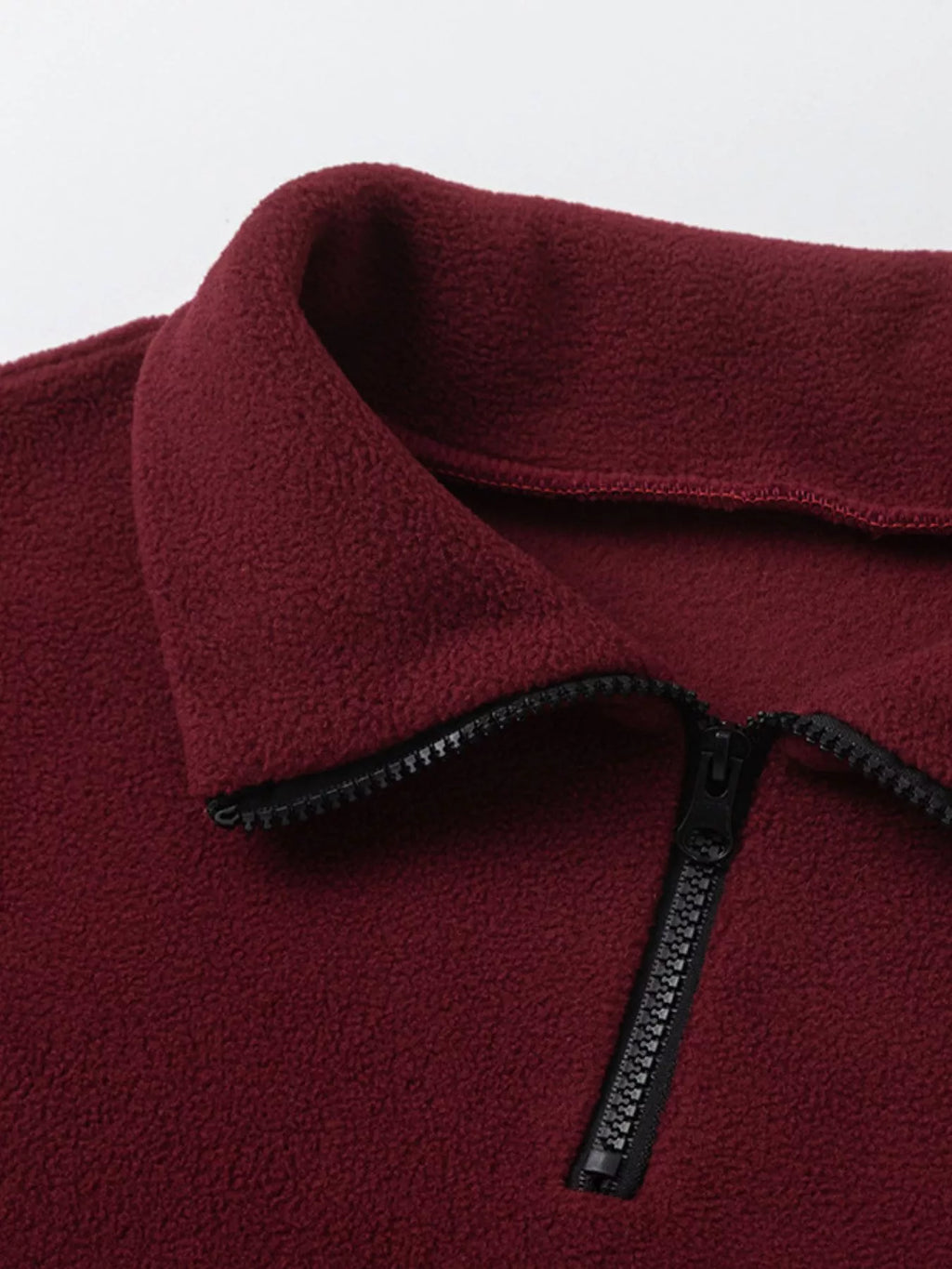 Burgundy quarter-zip sweatshirt with black zipper detail and stand collar.