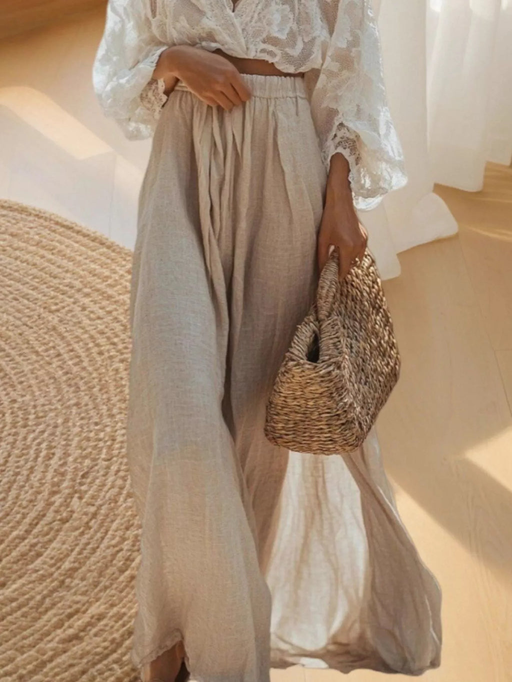 Cream lace long-sleeve top paired with pleated light beige maxi skirt