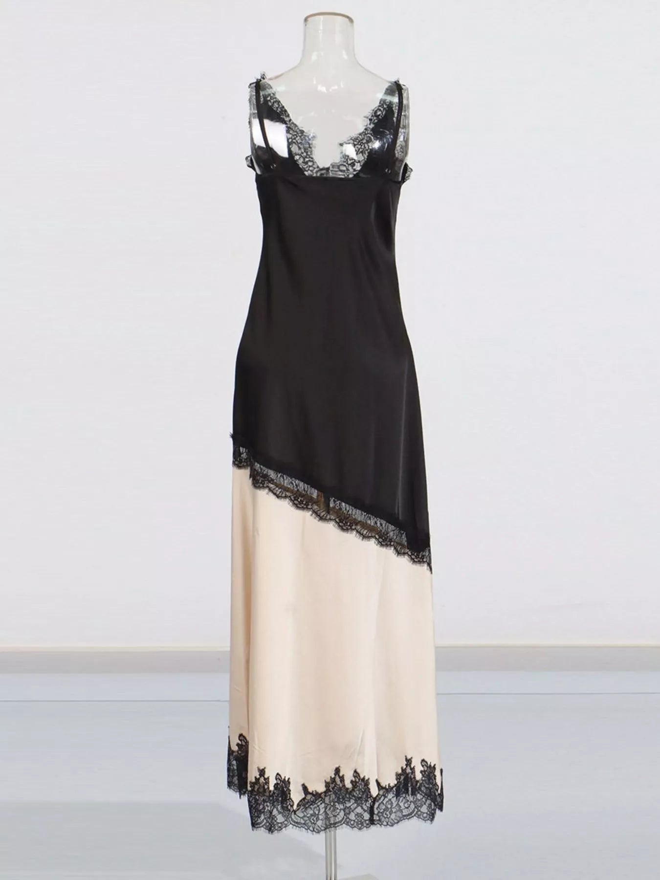 Two-tone lace-trim slip dress on mannequin, black camisole top and cream skirt with lace trim