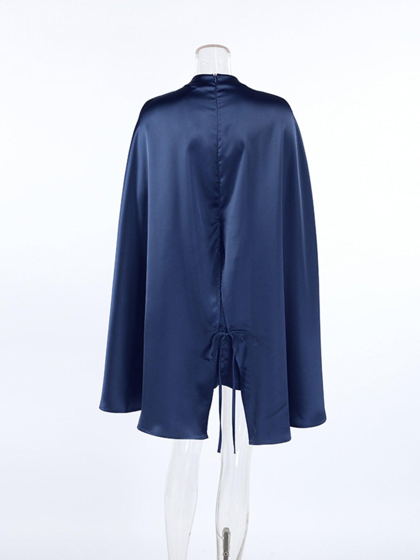 Navy mock neck cape sleeve mini dress with gathered back and tied waist seam