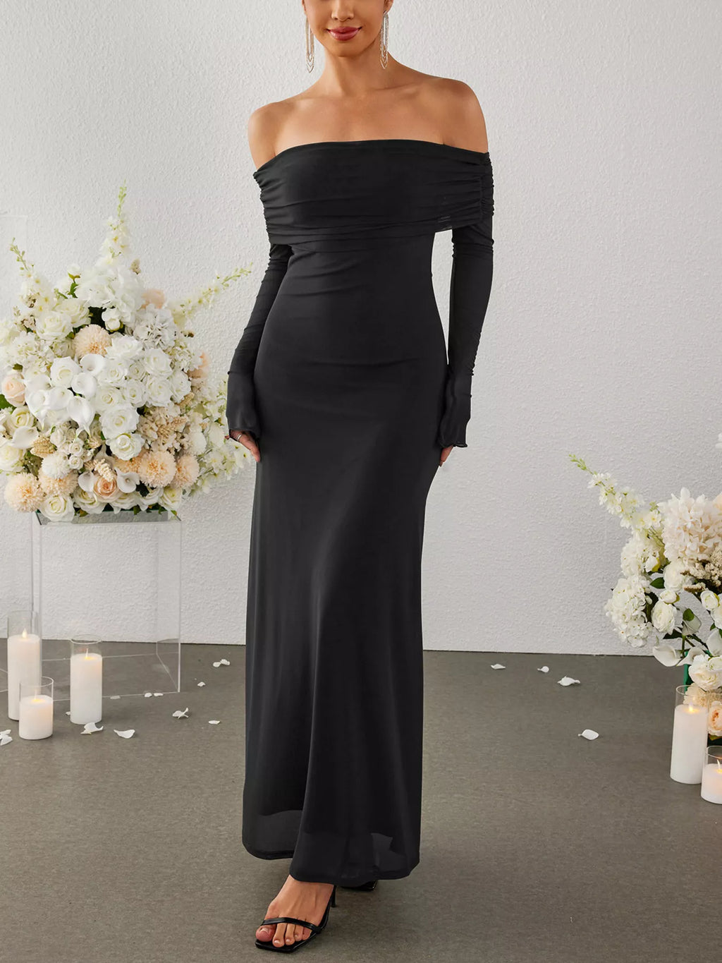 Black off-shoulder ruched long-sleeve maxi dress, standing portrait
