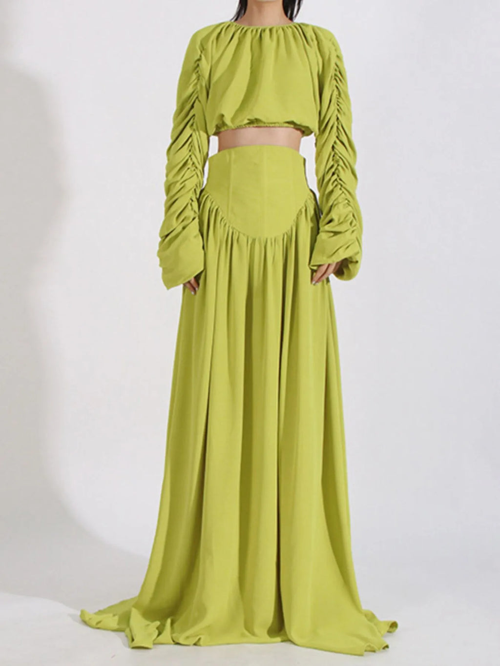 Green ruched long-sleeve crop top and high-waist maxi skirt, back view