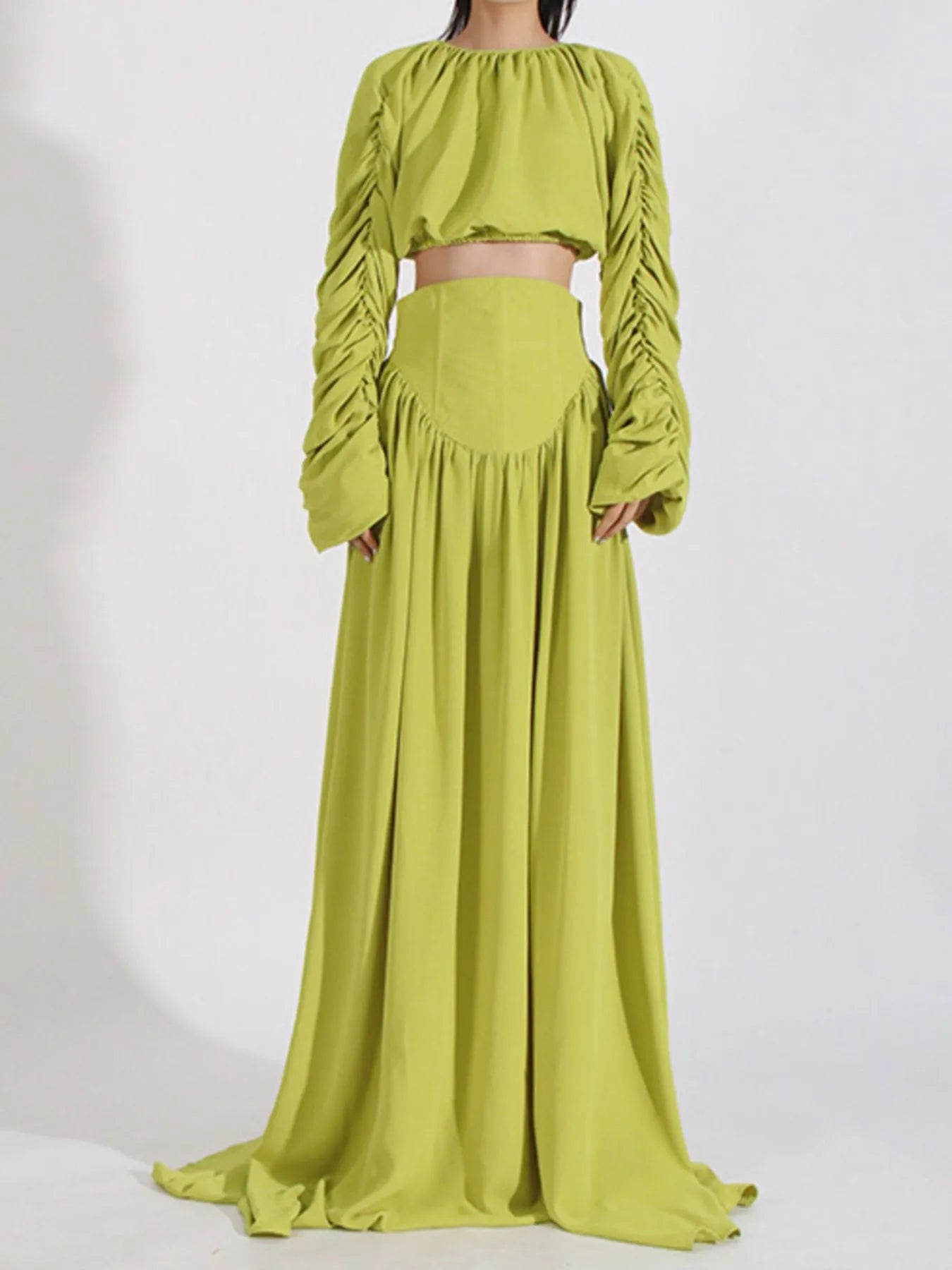 Green ruched long-sleeve crop top and high-waist maxi skirt, back view