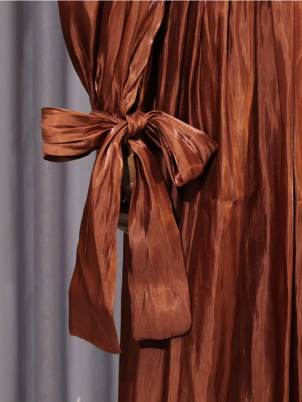 Coffee-brown draped maxi dress with long bow-tie waist detail