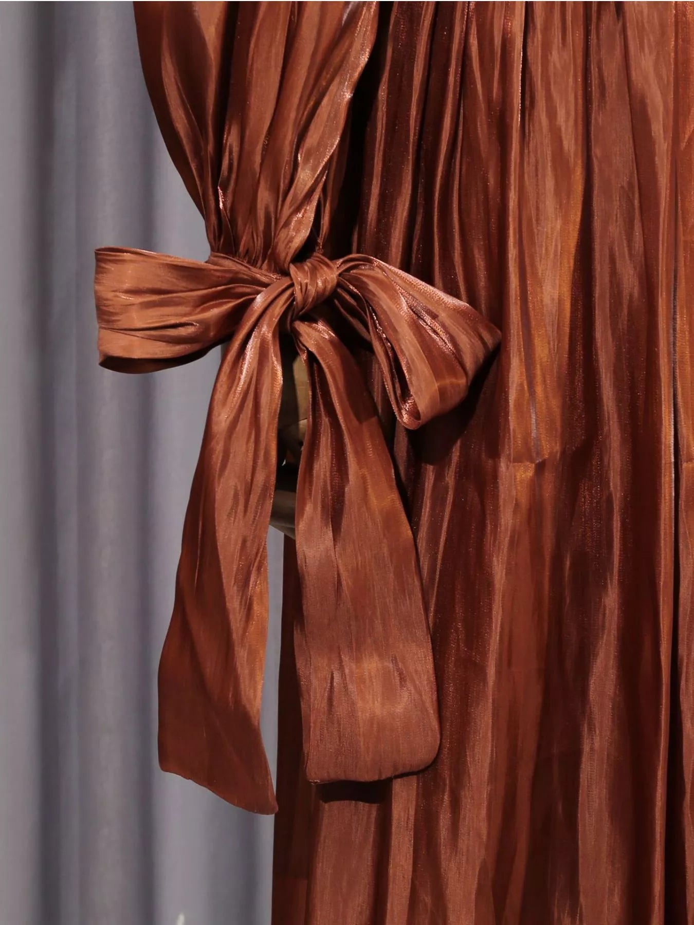 Coffee-brown draped maxi dress with long bow-tie waist detail