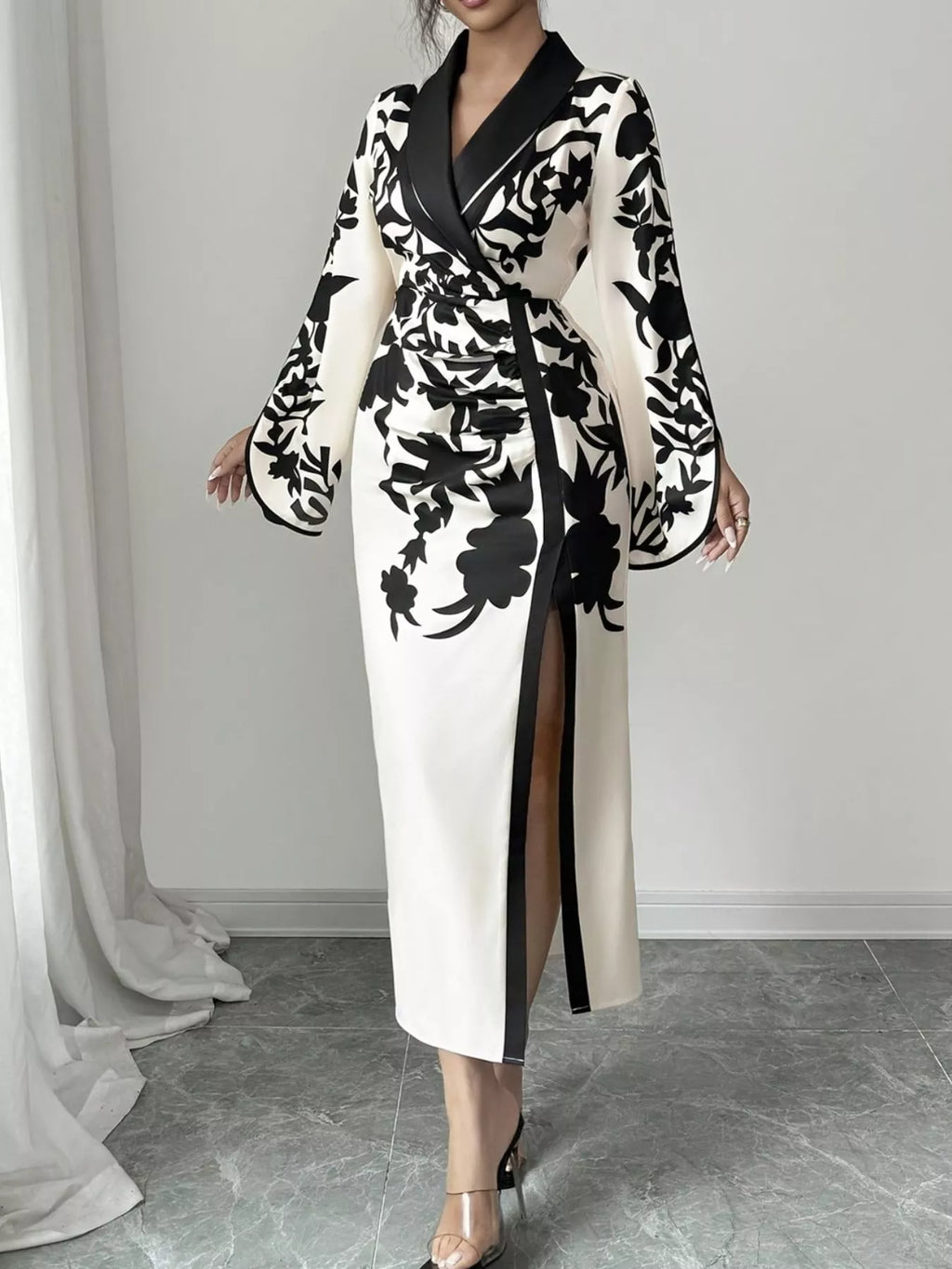 Black-and-white floral wrap midi dress with long sleeves, V-neck, and side slit