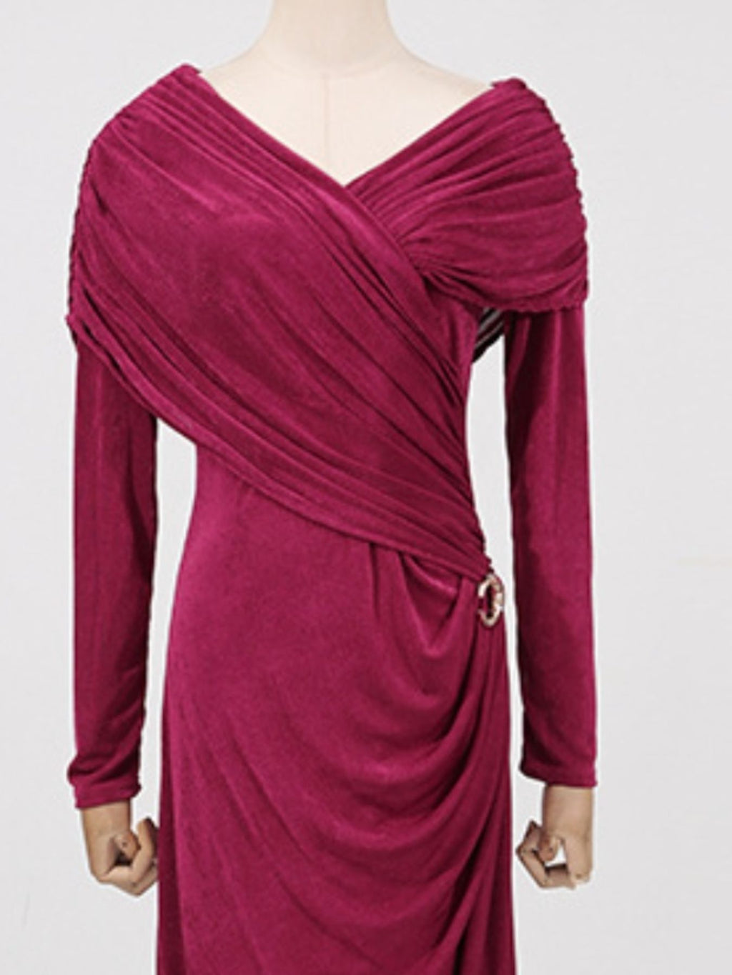 Red ruched draped maxi dress with long sleeves, V-neck crossover, and tied waist detail.
