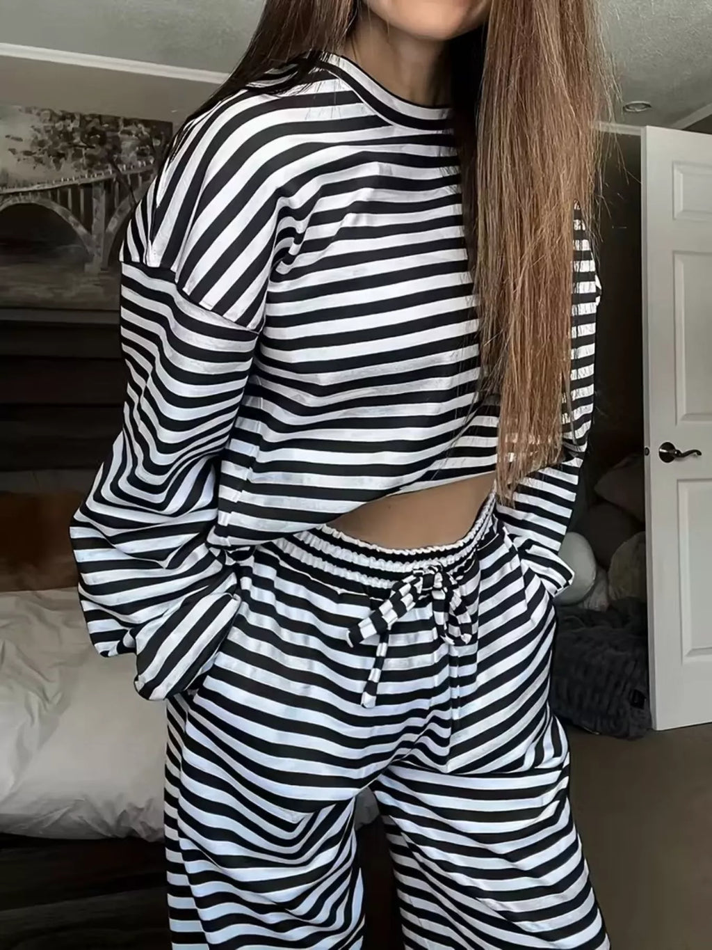 Black-and-white striped round-neck long-sleeve top and matching wide-leg pants set