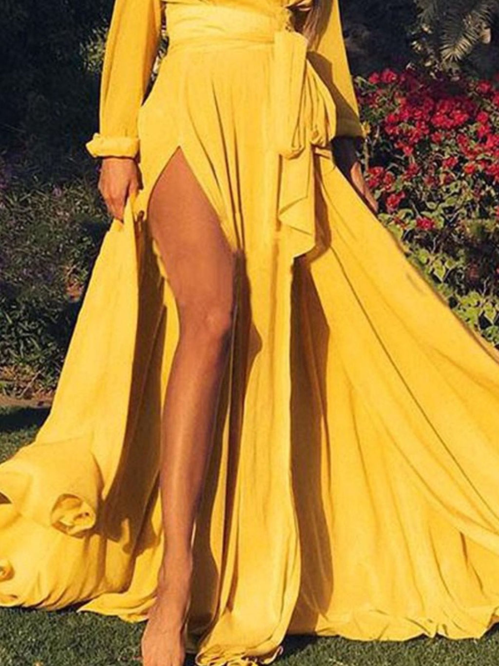Gold surplice maxi dress with long sleeves, layered skirt, side slit