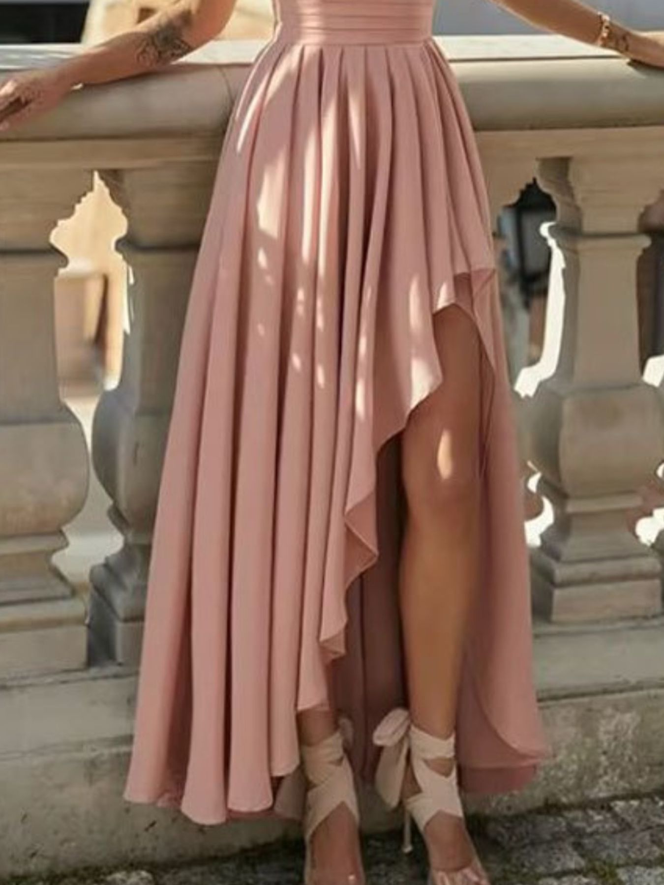 Dusty pink one-shoulder maxi dress with pleated skirt and asymmetrical side slit