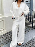 White zip-up jacket and wide-leg pants set with drawstring waist
