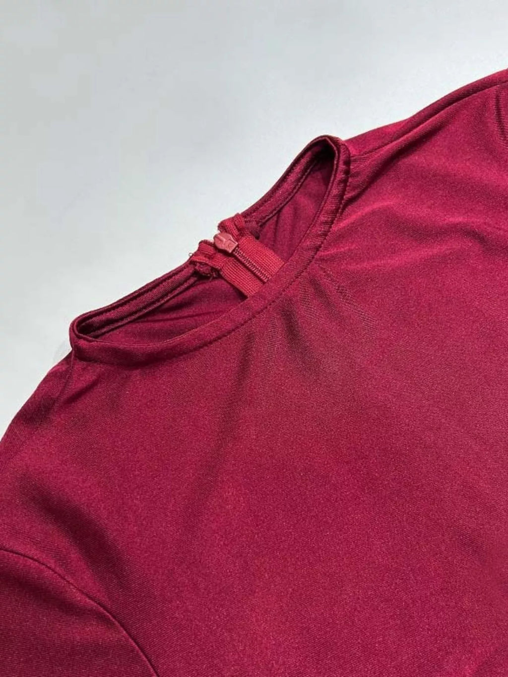 Burgundy ruched maxi dress close-up of neckline and long sleeves