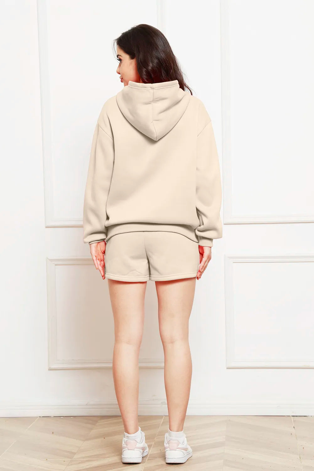 Ivory drop-shoulder hoodie and shorts set, back view with adjustable hood.