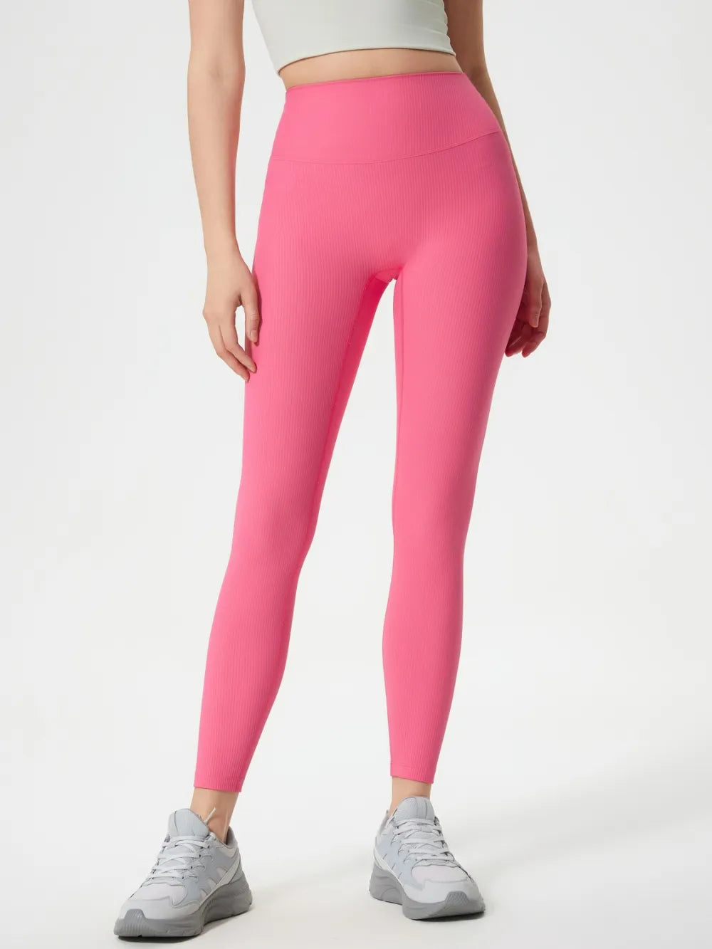 Pink high-waist active leggings, full-length fitted, smooth stretch look.