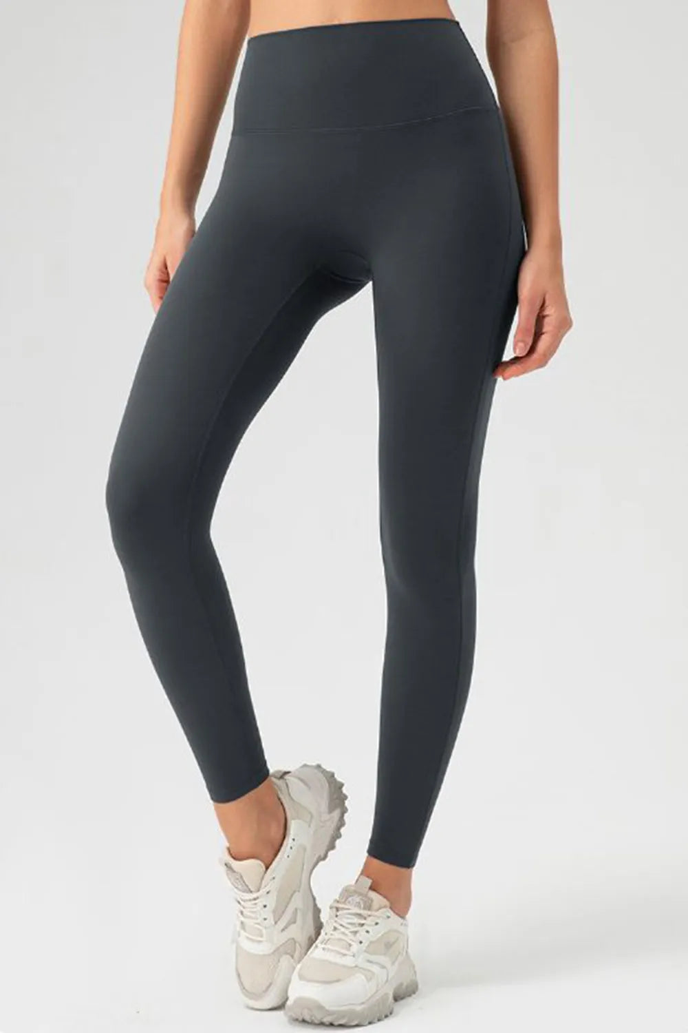 Dark gray high-waist skinny active pants, side profile, ankle length