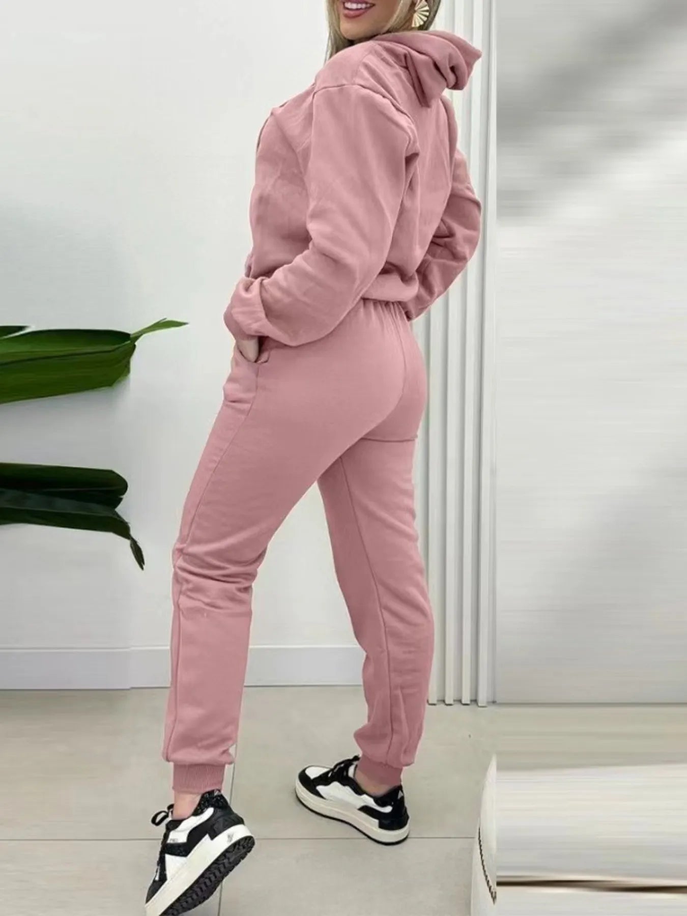 Pink two-piece long-sleeve hoodie and joggers set with ribbed cuffs and drawstring