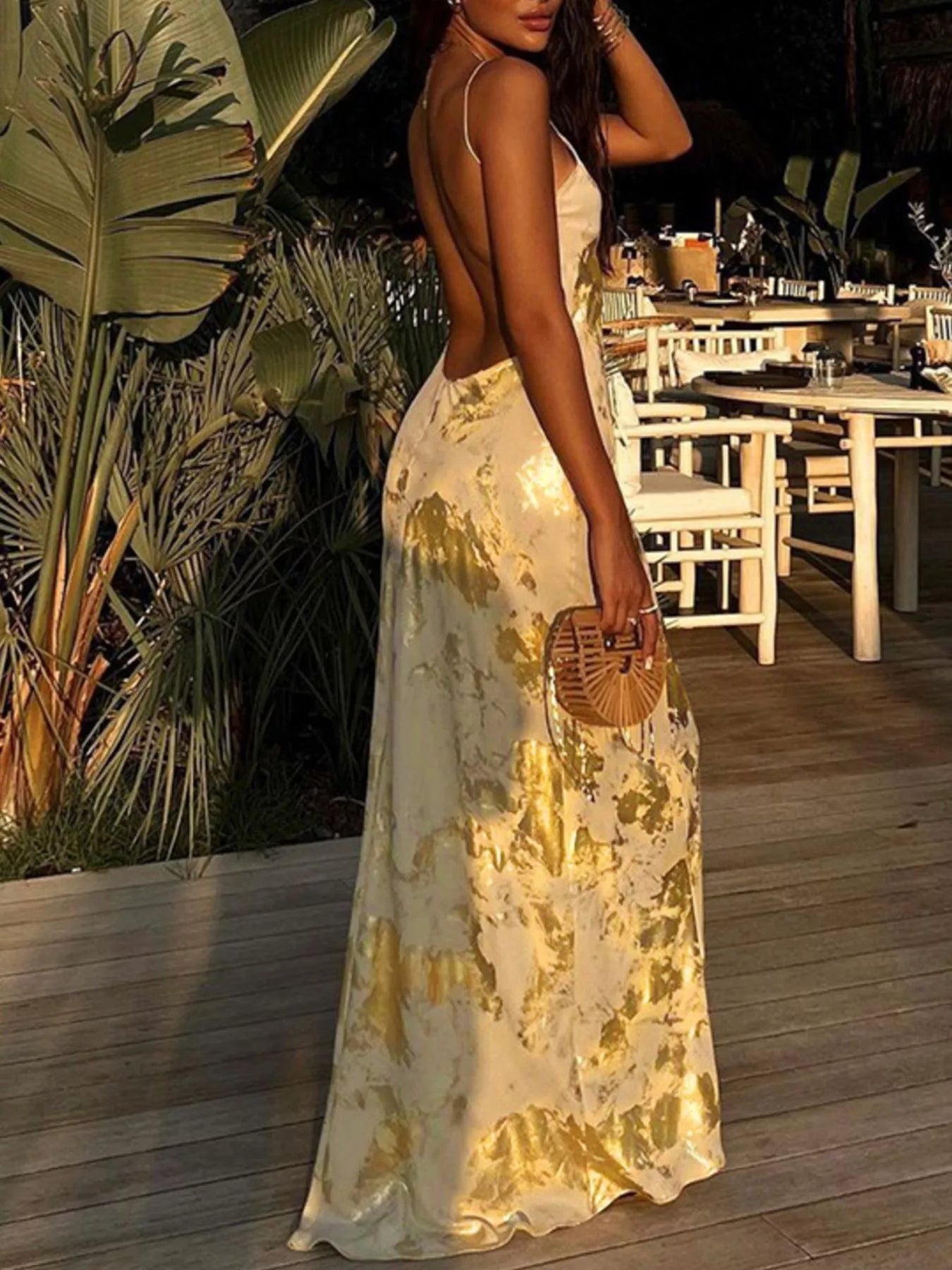 Gold backless V-neck maxi dress, sleeveless with V-neck and flowing maxi skirt