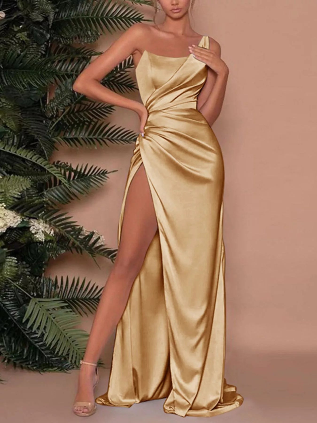 Gold one-shoulder satin maxi dress with draped bodice and high side slit