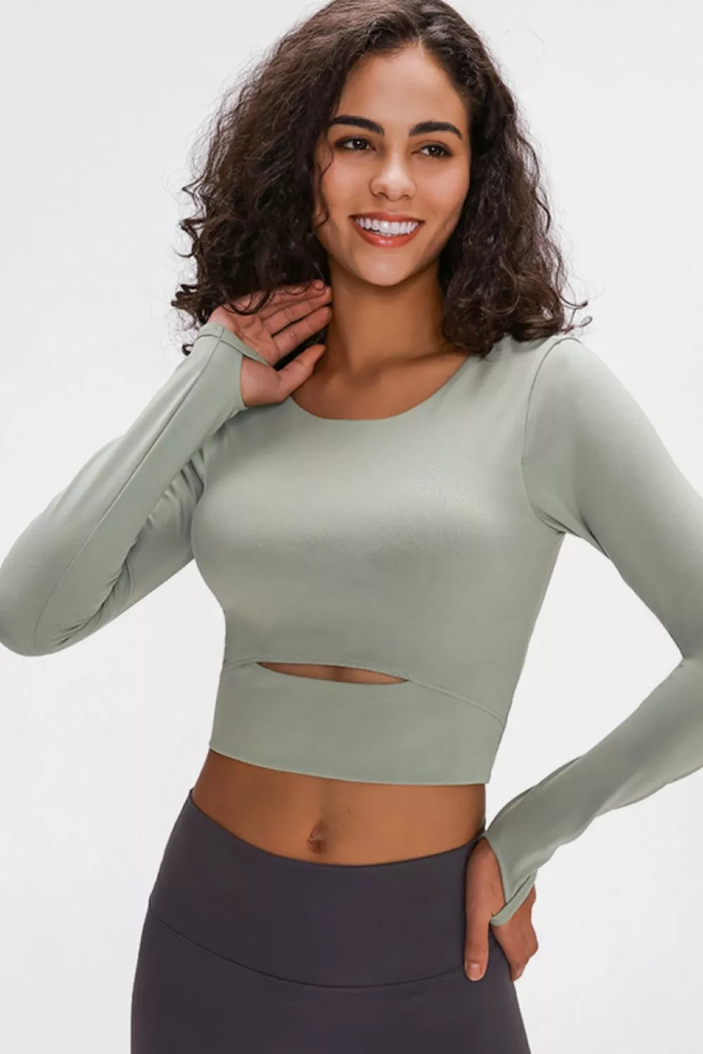 Sage green long-sleeve cropped sports top with center chest cutout