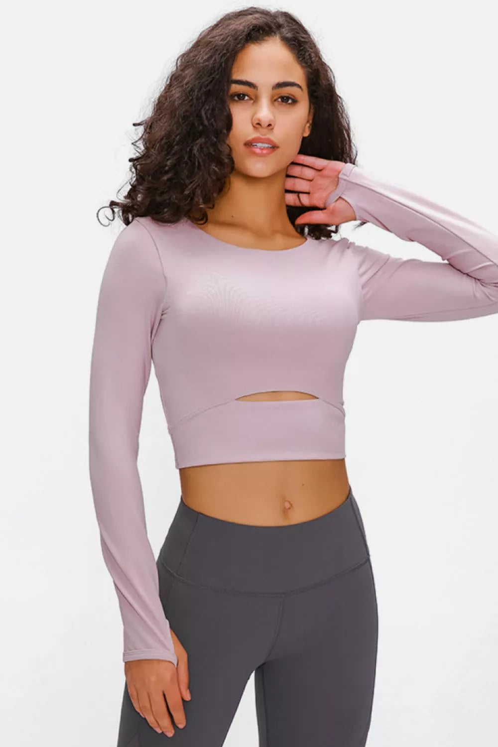 Blush pink long-sleeve cropped sports top with chest cutout and crew neck