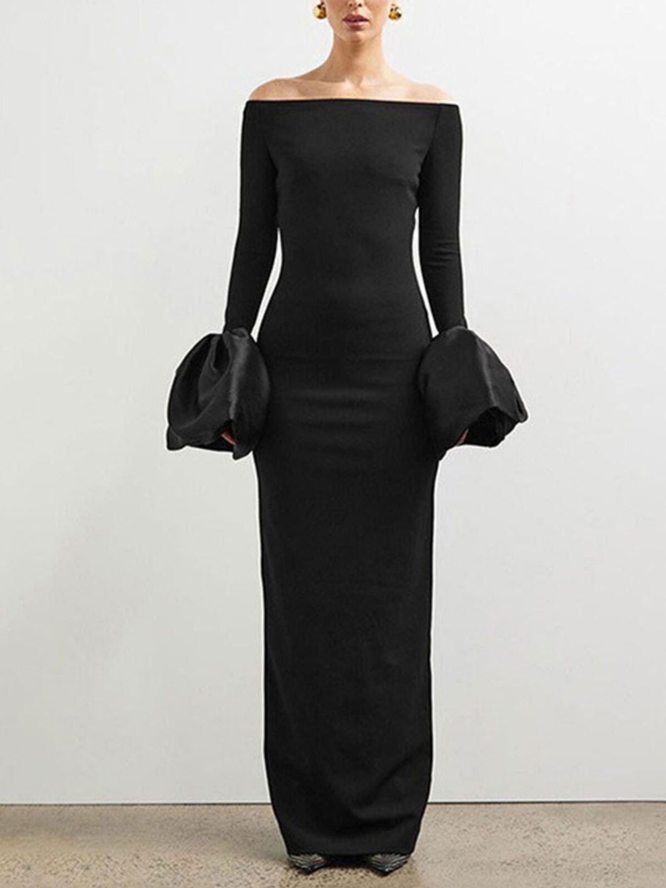 Black off-shoulder maxi dress with long sleeves and gathered flounce cuffs