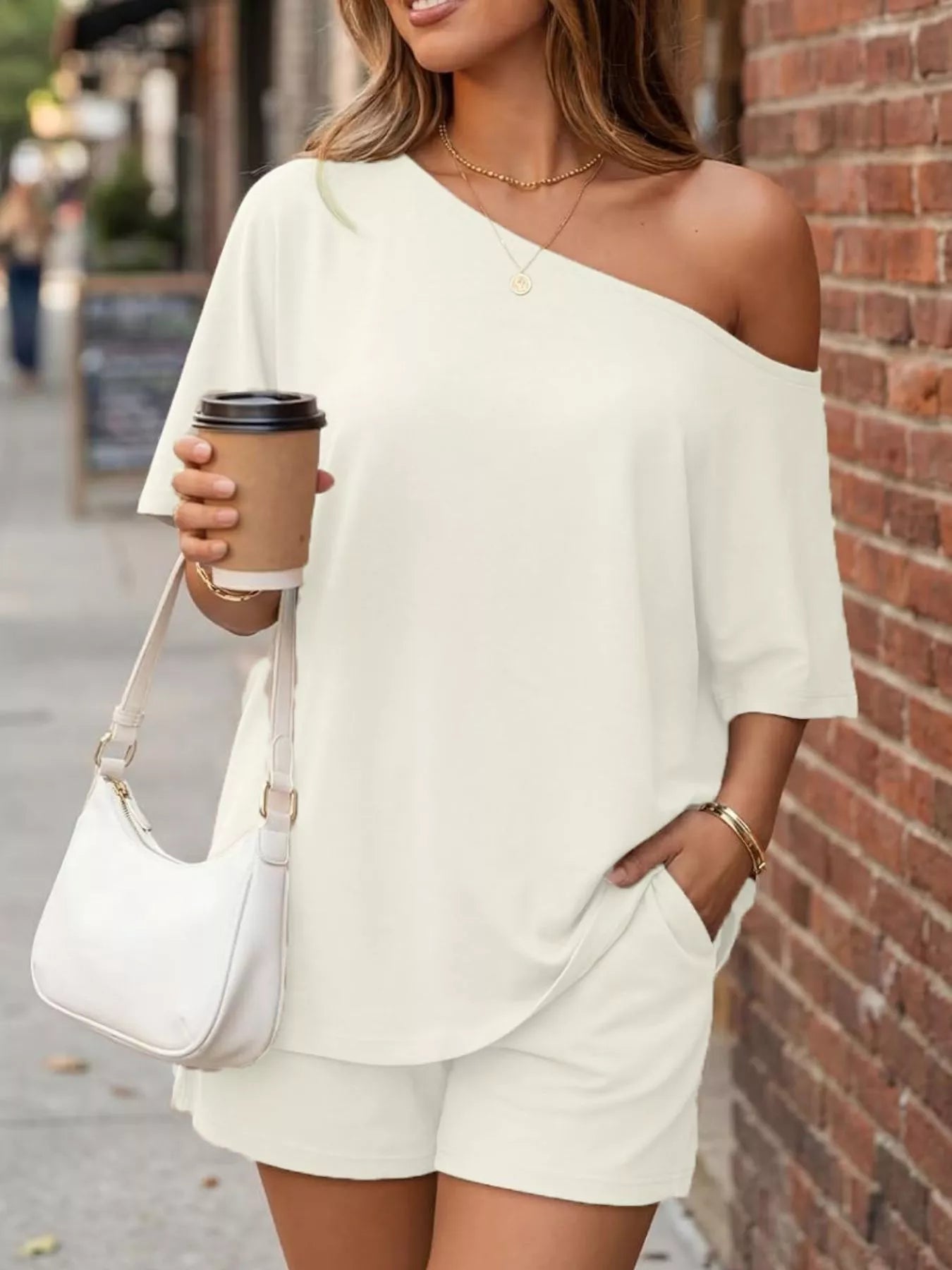 Cream one-shoulder top and matching shorts set, loose fit with short sleeves