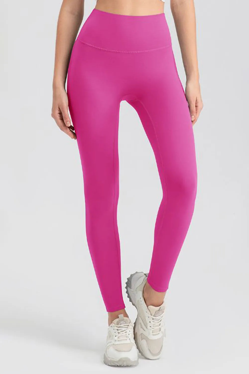High-waist skinny active pants in bright pink, full-length, contoured seams