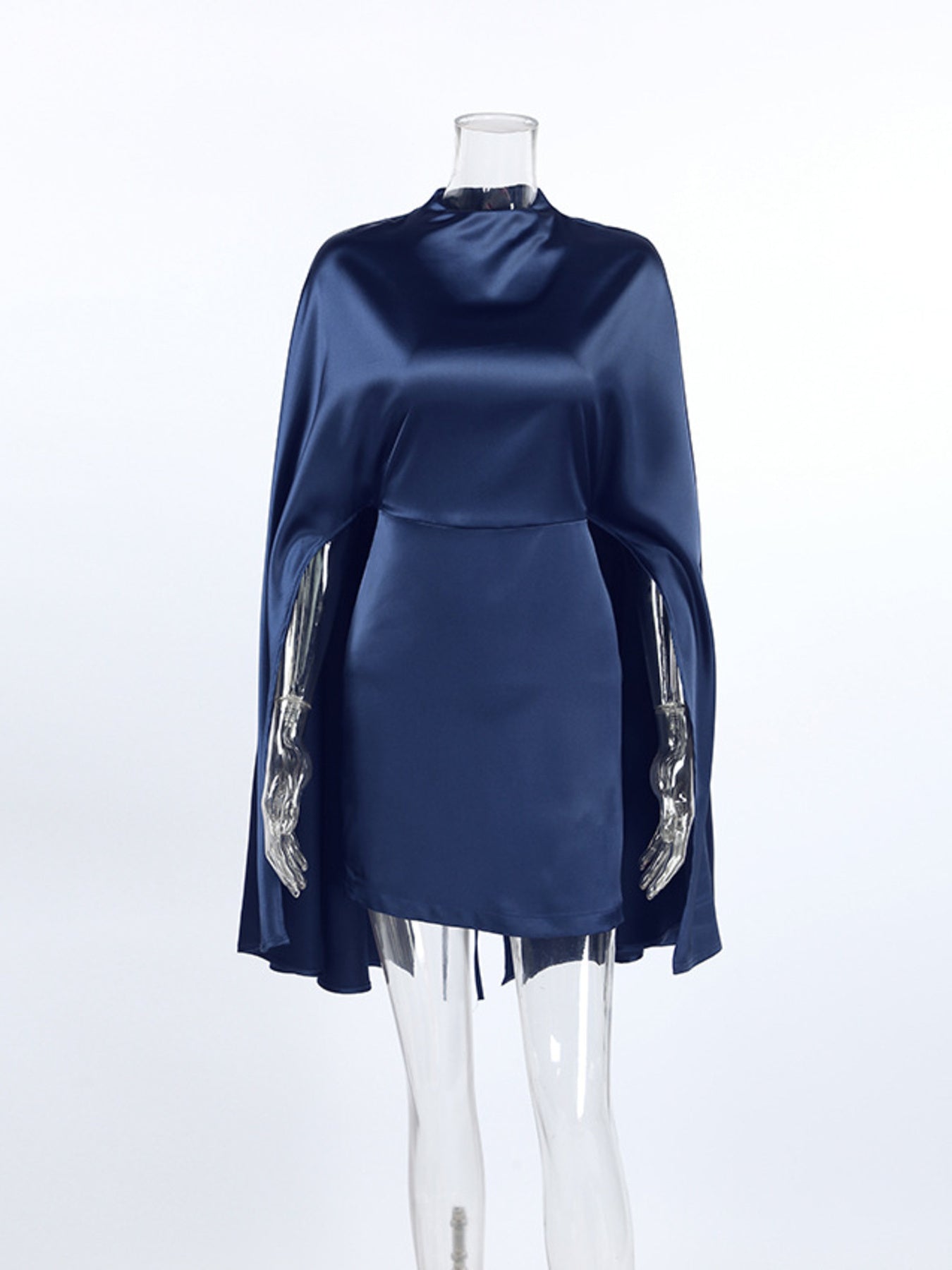 Navy mock neck cape sleeve mini dress on a mannequin, fringed sleeve edge detail