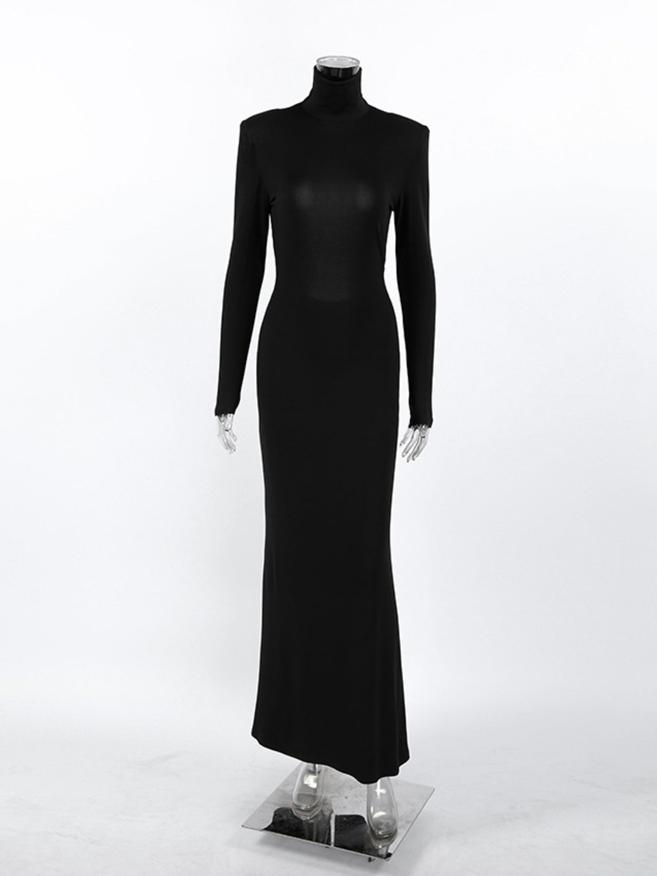Black backless turtleneck long-sleeve bodycon maxi dress on mannequin