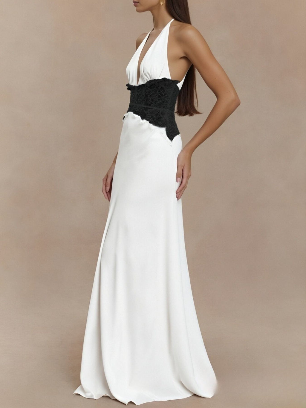 White halter maxi dress with black lace bodice and back cutout, flowing floor-length skirt