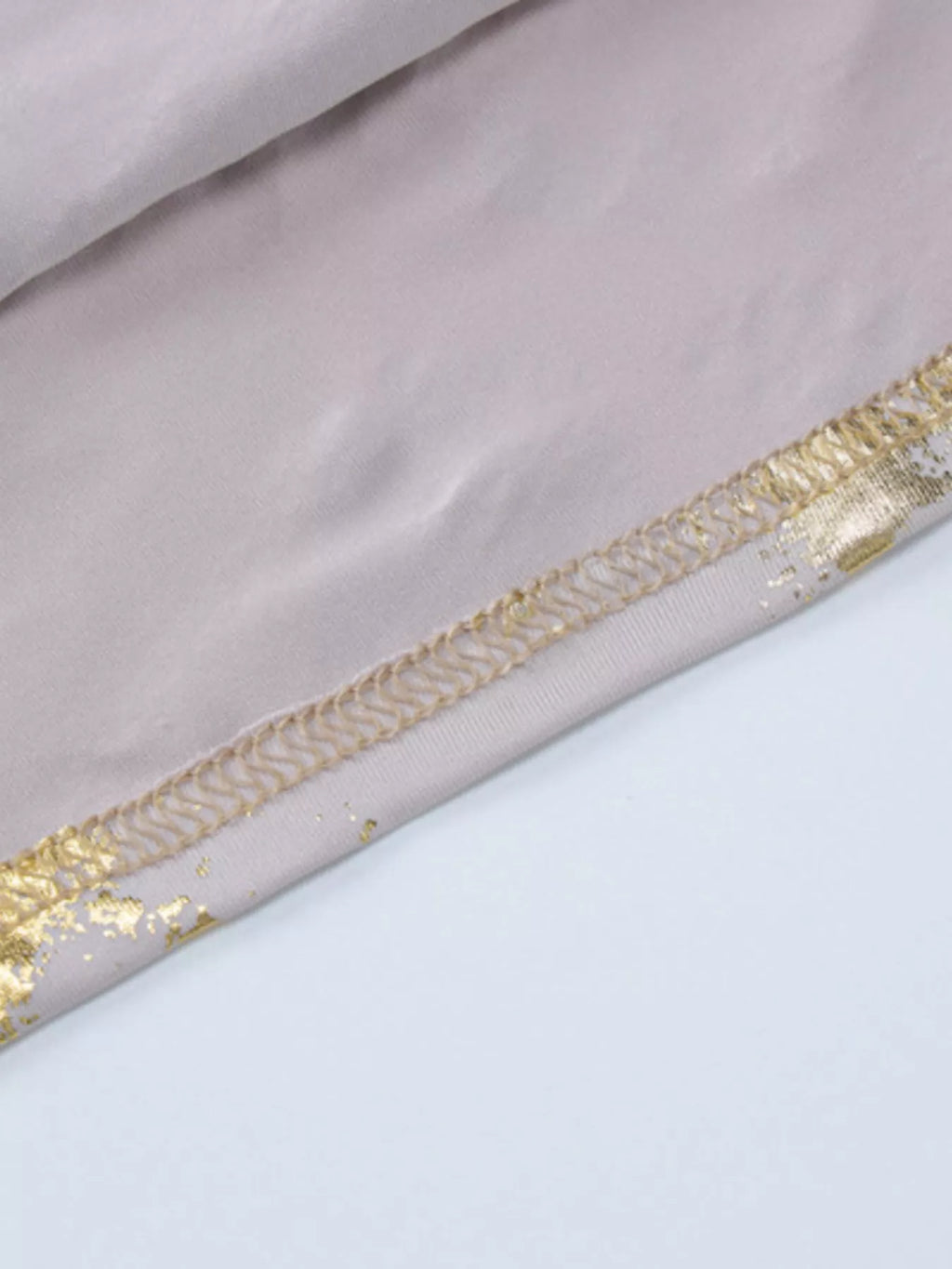 Gold sequin trim along neckline edge of V-neck maxi dress