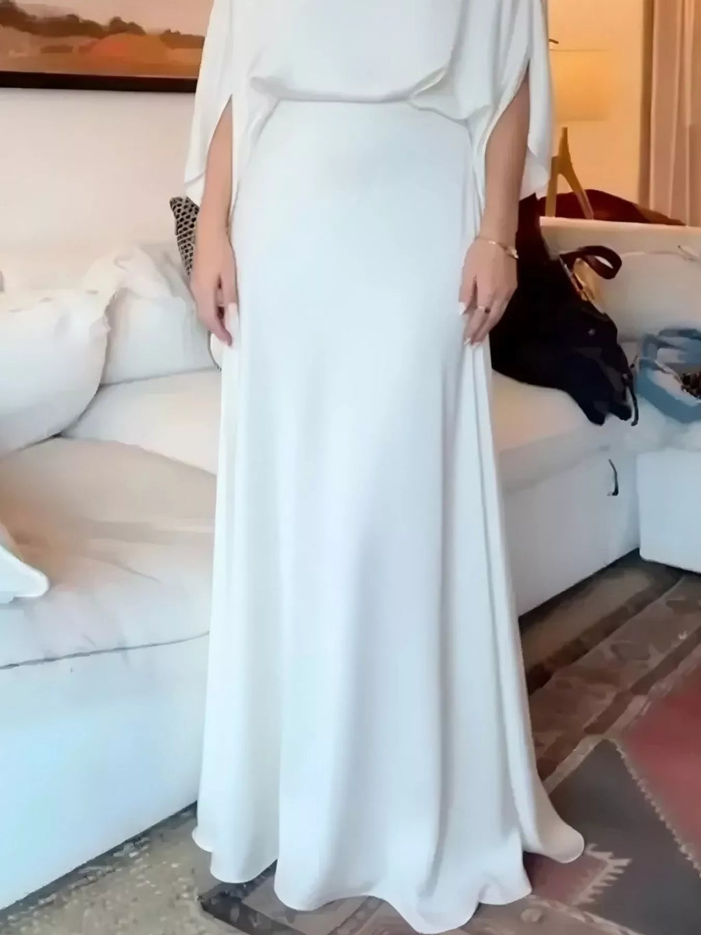 White satin maxi dress with batwing sleeves and draped bodice detailing