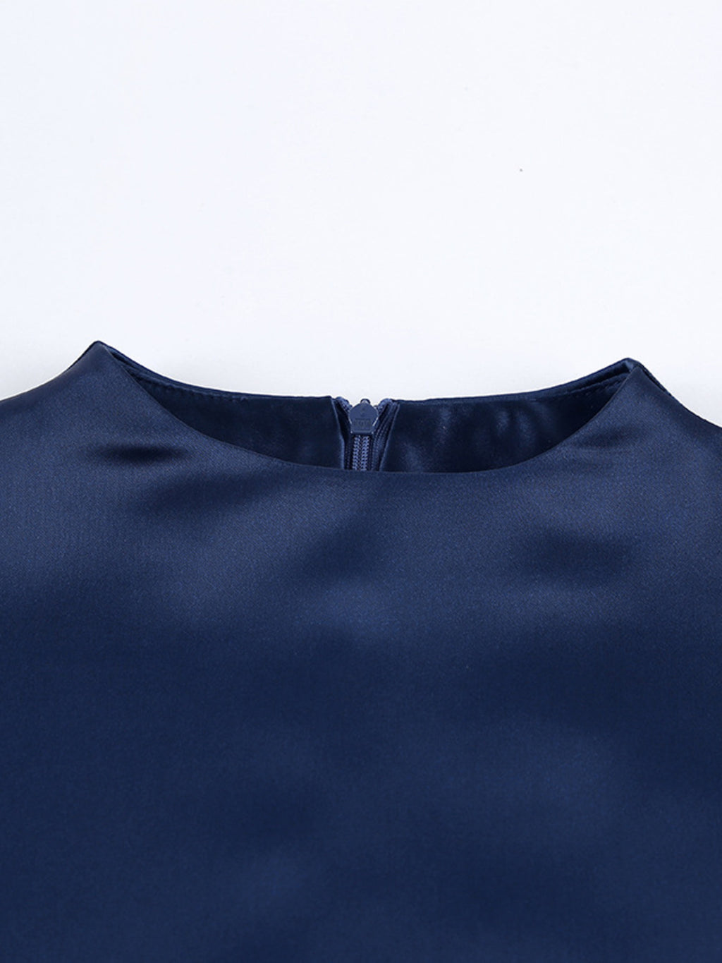 Navy mock neck mini dress close-up of neckline seam and small back tie