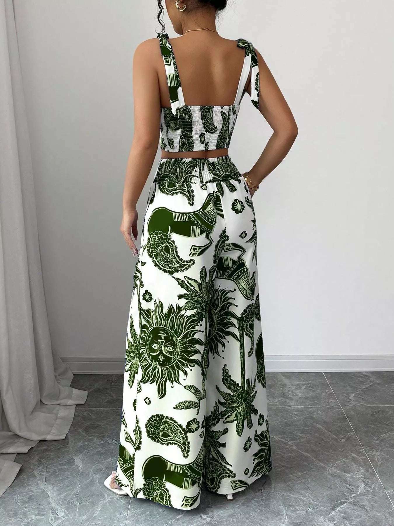 Green and white floral sleeveless crop top and wide-leg pants set, back view