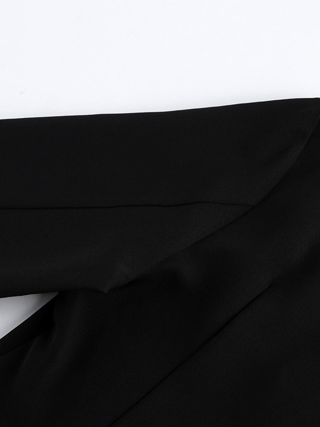 Black ruched surplice long-sleeve dress with draped wrap bodice close-up
