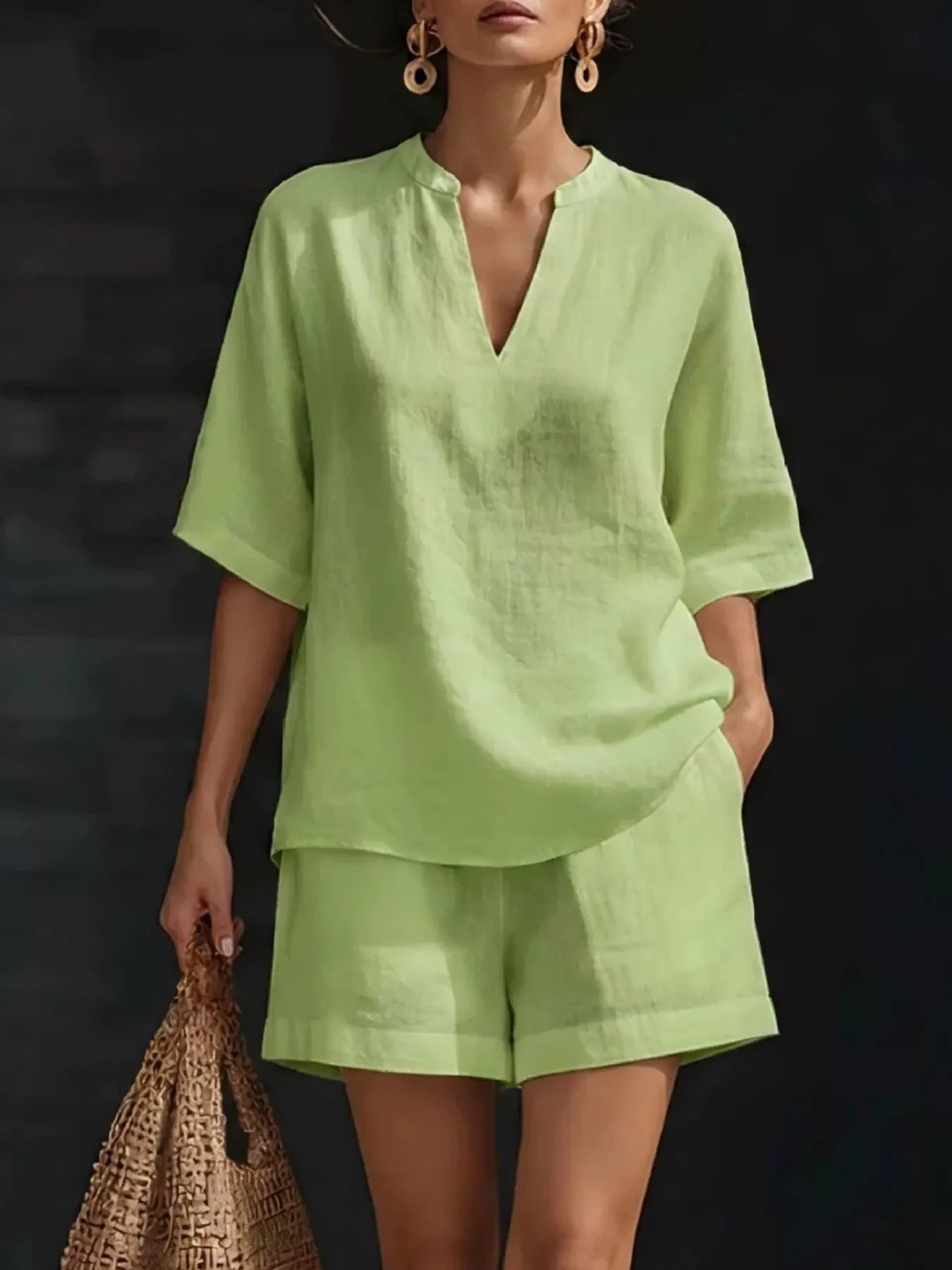 Light green half-sleeve V-neck top and matching shorts set with notched neckline