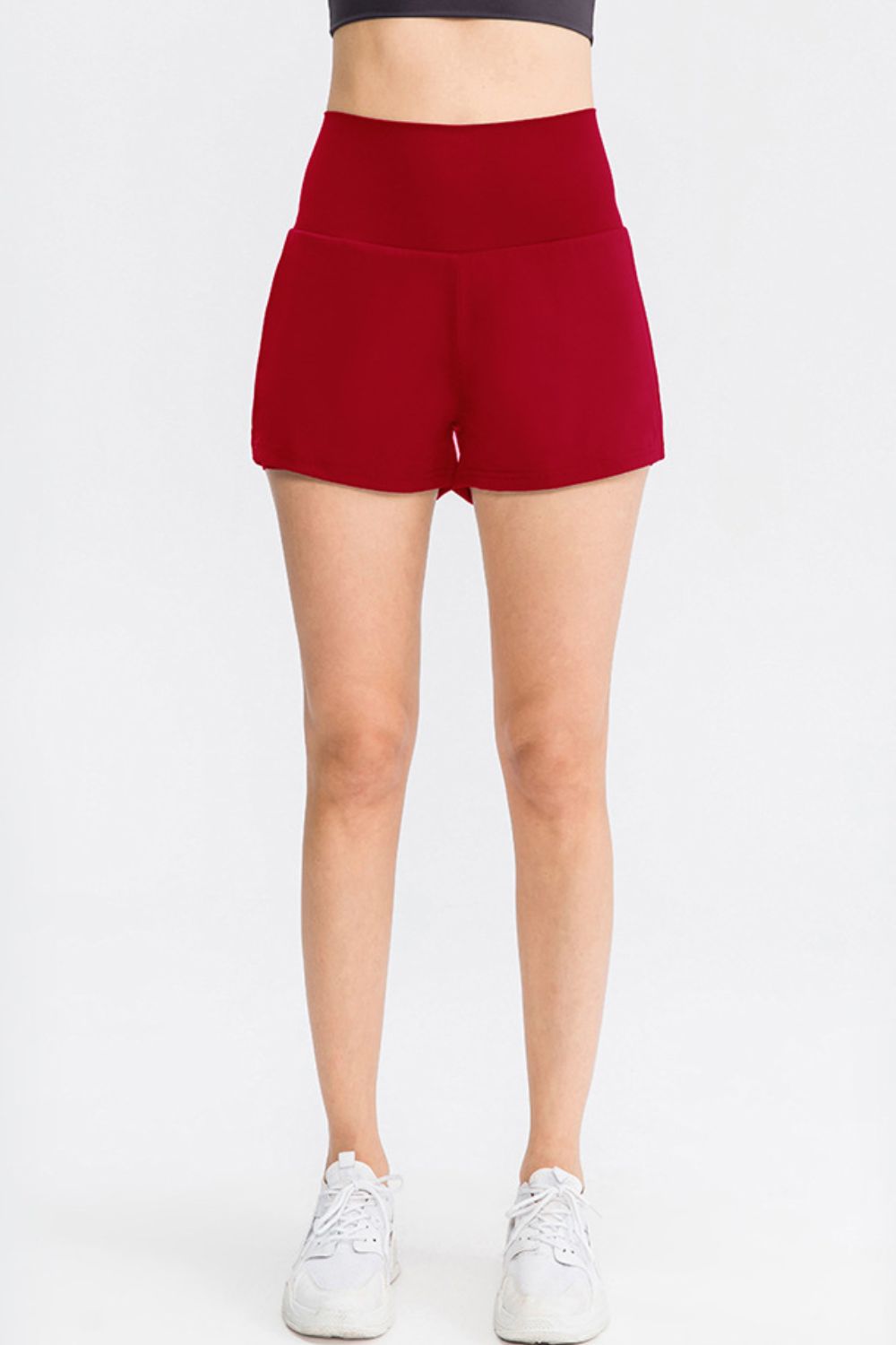 Women’s deep red sports shorts with wide waistband and side pockets