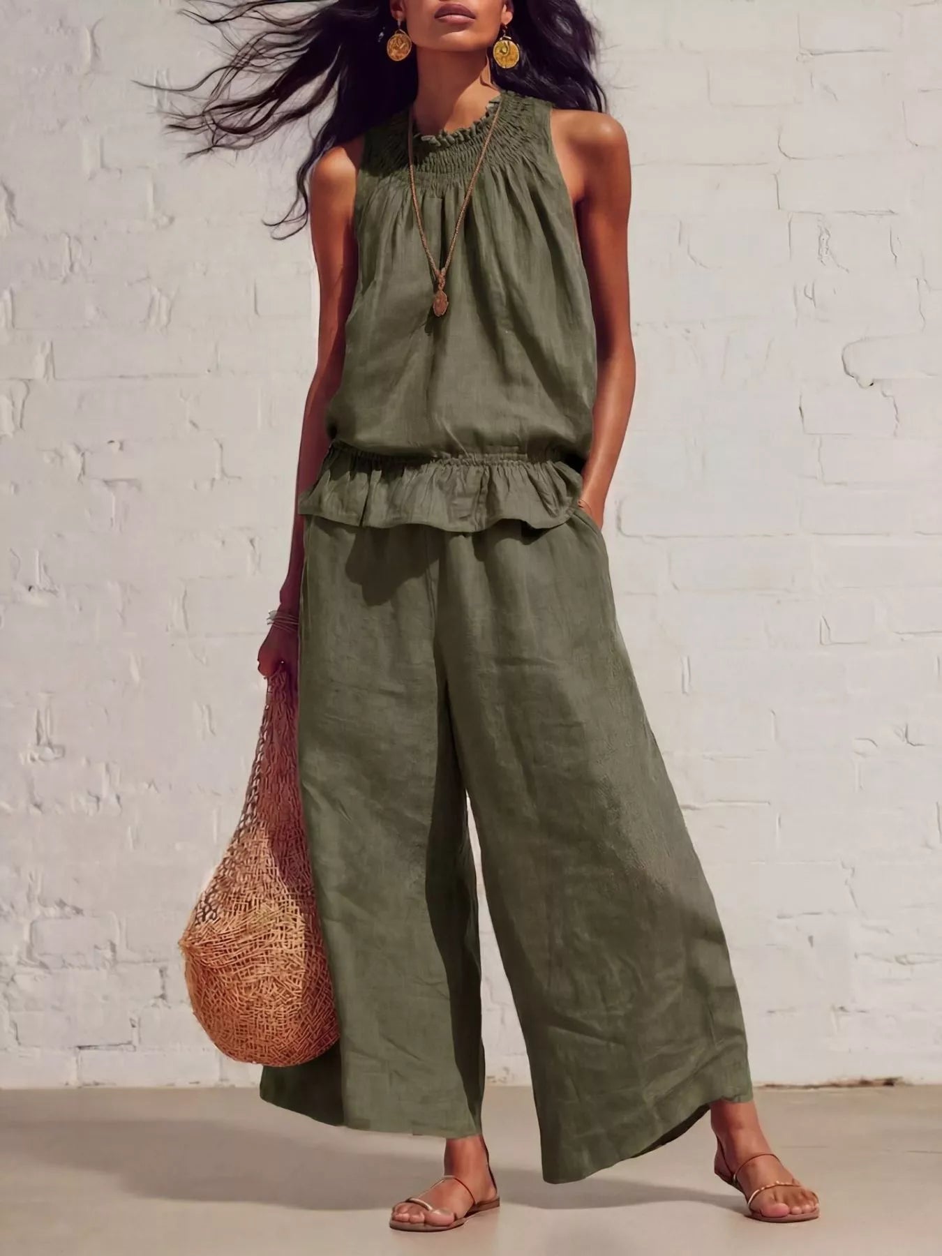Army green sleeveless smocked ruffled hem top and wide-leg pants set with tiered hem.