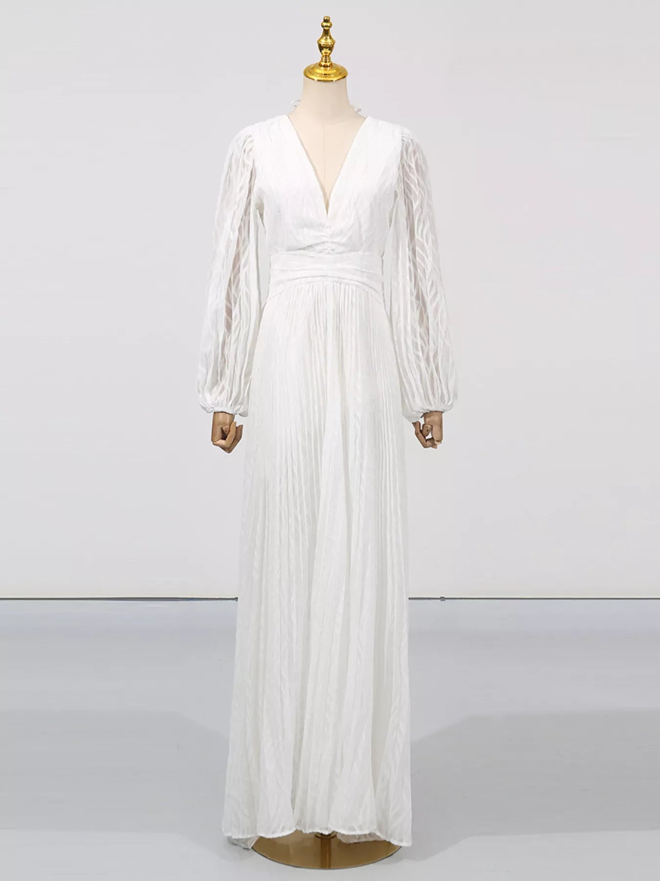 White v-neck long-sleeve maxi dress with puff sleeves and cinched waist